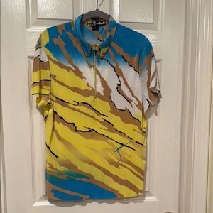 Jamie Sadock Blue and Yellow Golf blouse with Dynamic Stripes and Gold Detailing